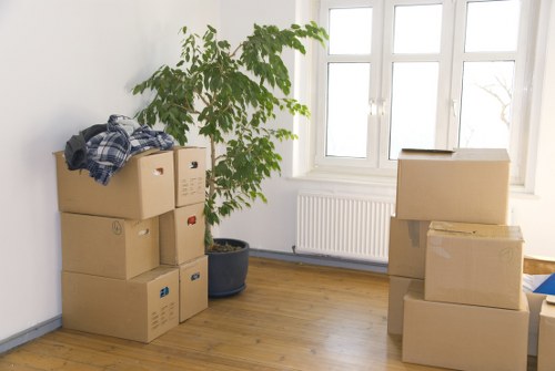 Office furniture and boxes prepared for a commercial move near Monken Hadley