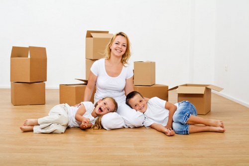 House moving service preparing boxes and furniture for transport in Monken Hadley