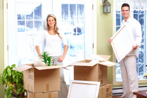 Preparing unwanted furniture for pick-up in Monken Hadley before collection