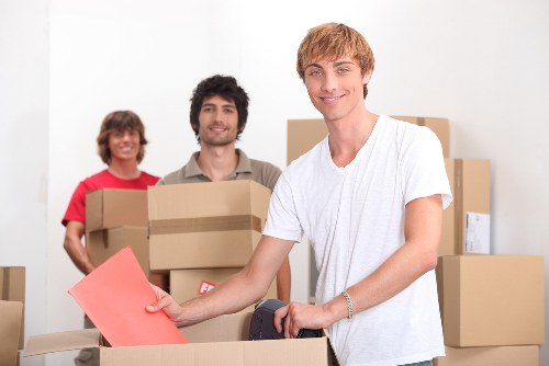 Boxes and furniture being moved during a local home relocation